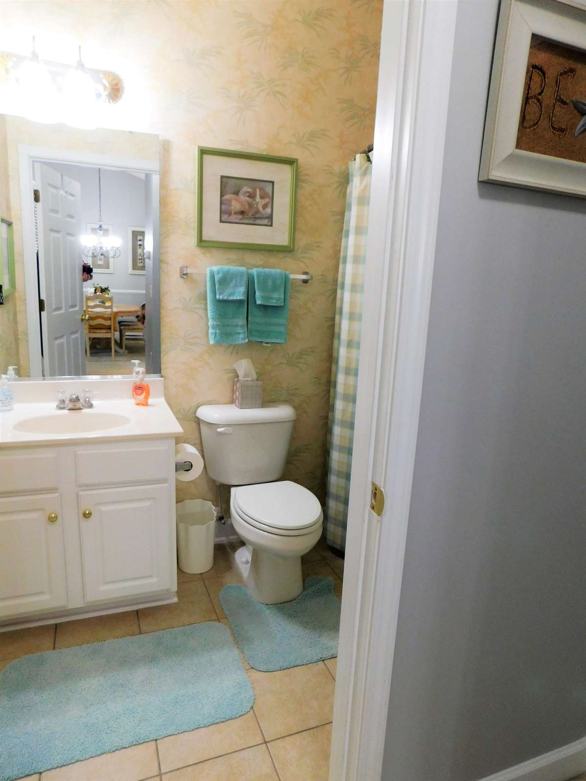 bathroom in hall with tub/shower combo