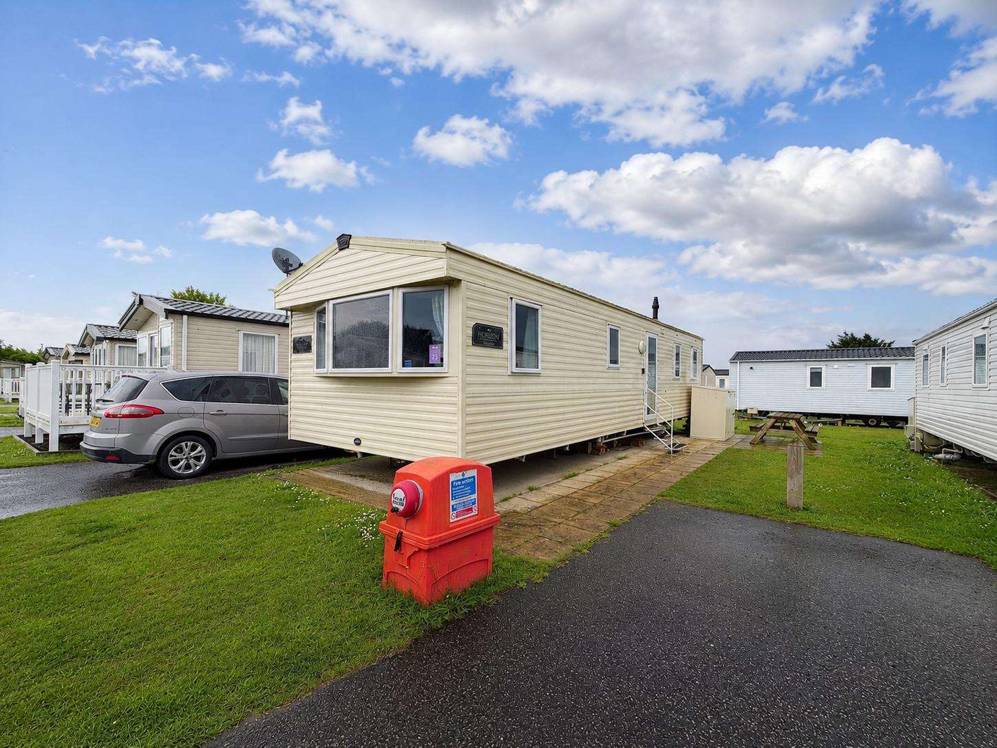 Comfortable 3-bedroom caravan sleeping up to 8 guests, ideal for family holidays by the coast. - property