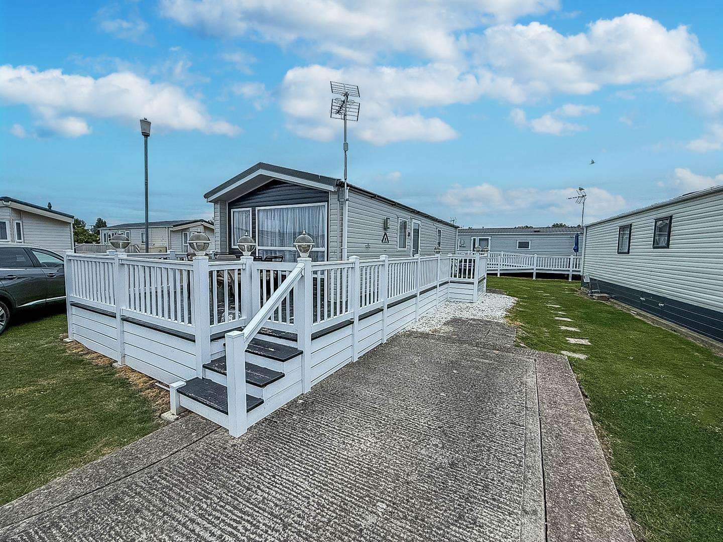 Decking offers the perfect space to relax and unwind outside the static caravan on a UK break away. - property