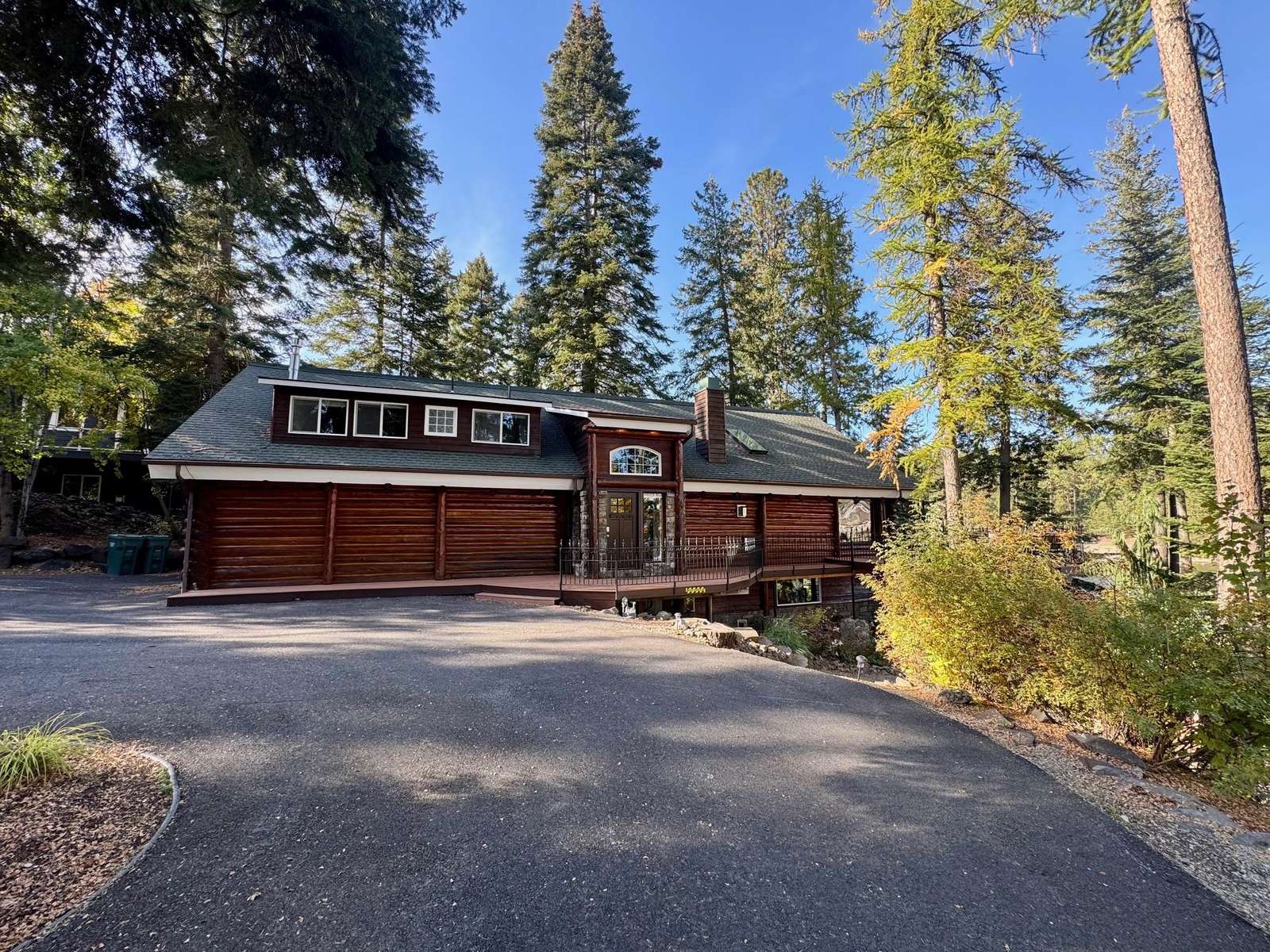 Spacious mountain home surrounded by towering pine trees