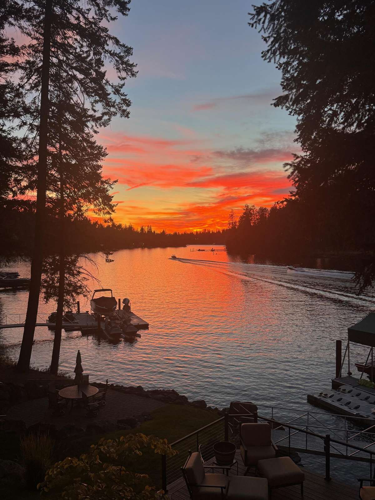 Tranquil lakeside dock at sunset, perfect for unwinding
