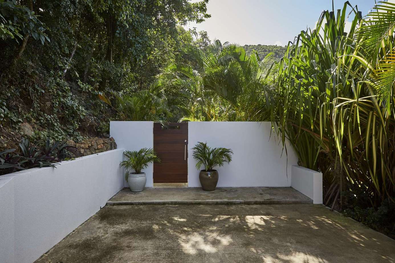 Secluded outdoor patio surrounded by lush greenery for peaceful relaxation