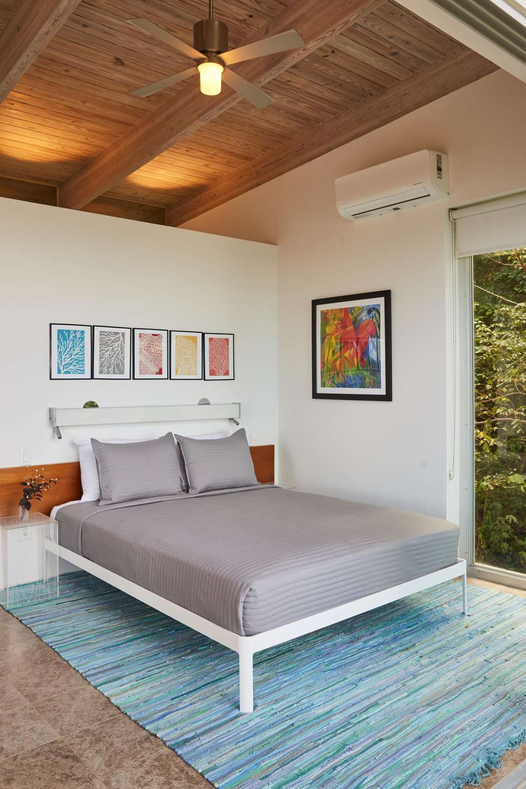 Serene bedroom with vaulted wood ceiling and natural light