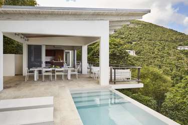 Secluded patio with infinity pool and panoramic hillside views