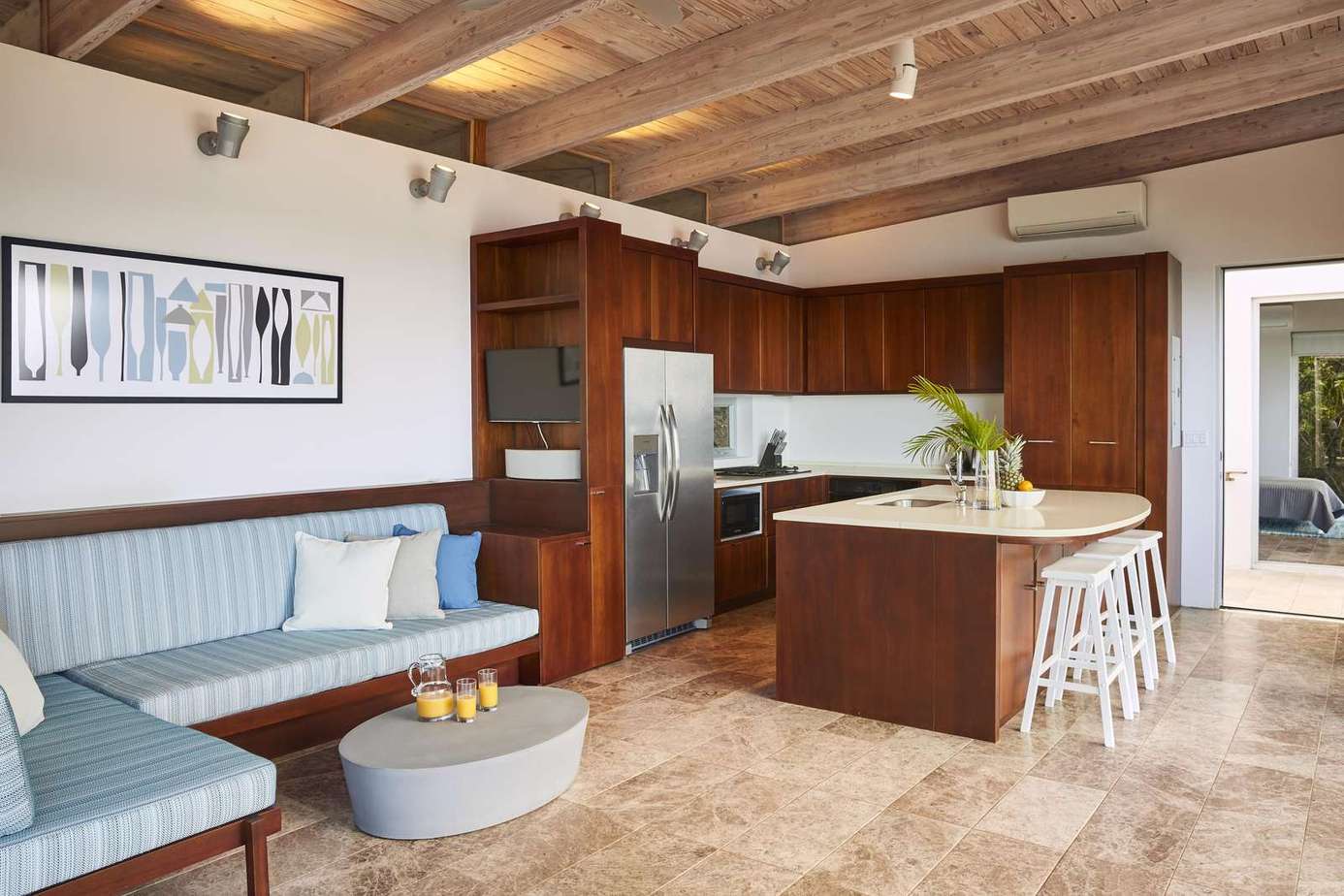 Spacious kitchen and cozy dining nook with vaulted ceilings