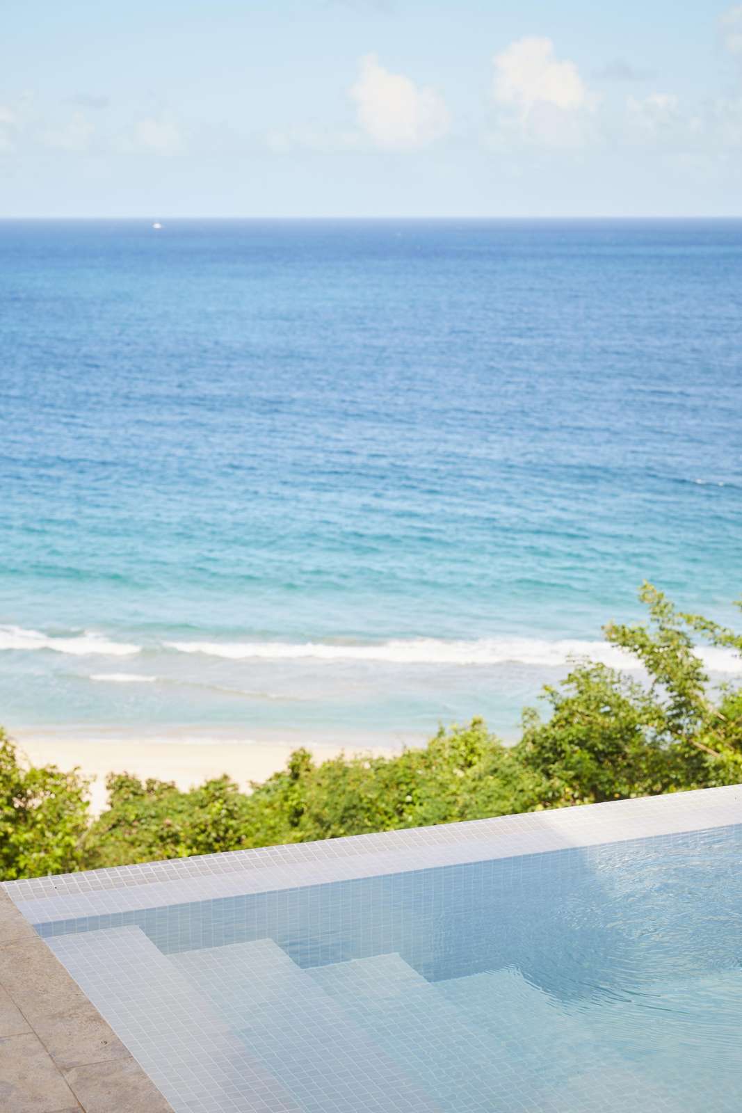 Oceanfront poolside retreat with stunning beach views