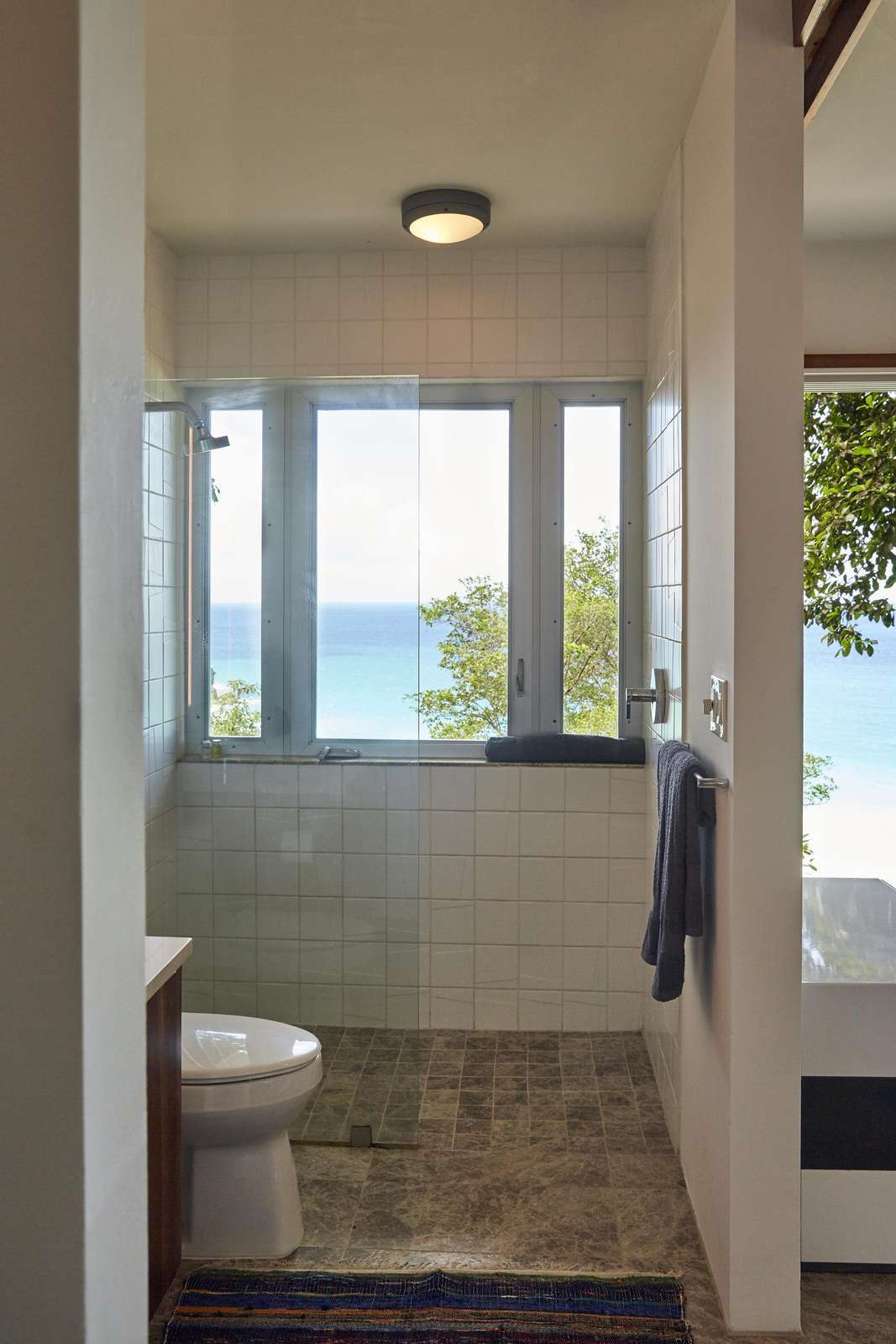 Bright bathroom with ocean views and natural light