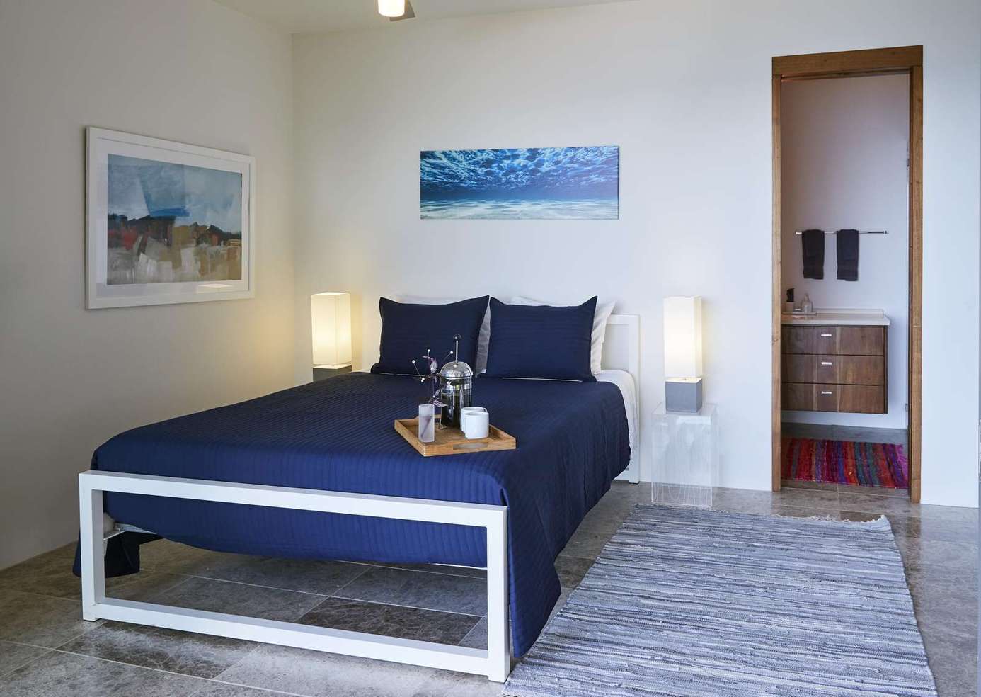Cozy bedroom retreat with modern art and soft lighting