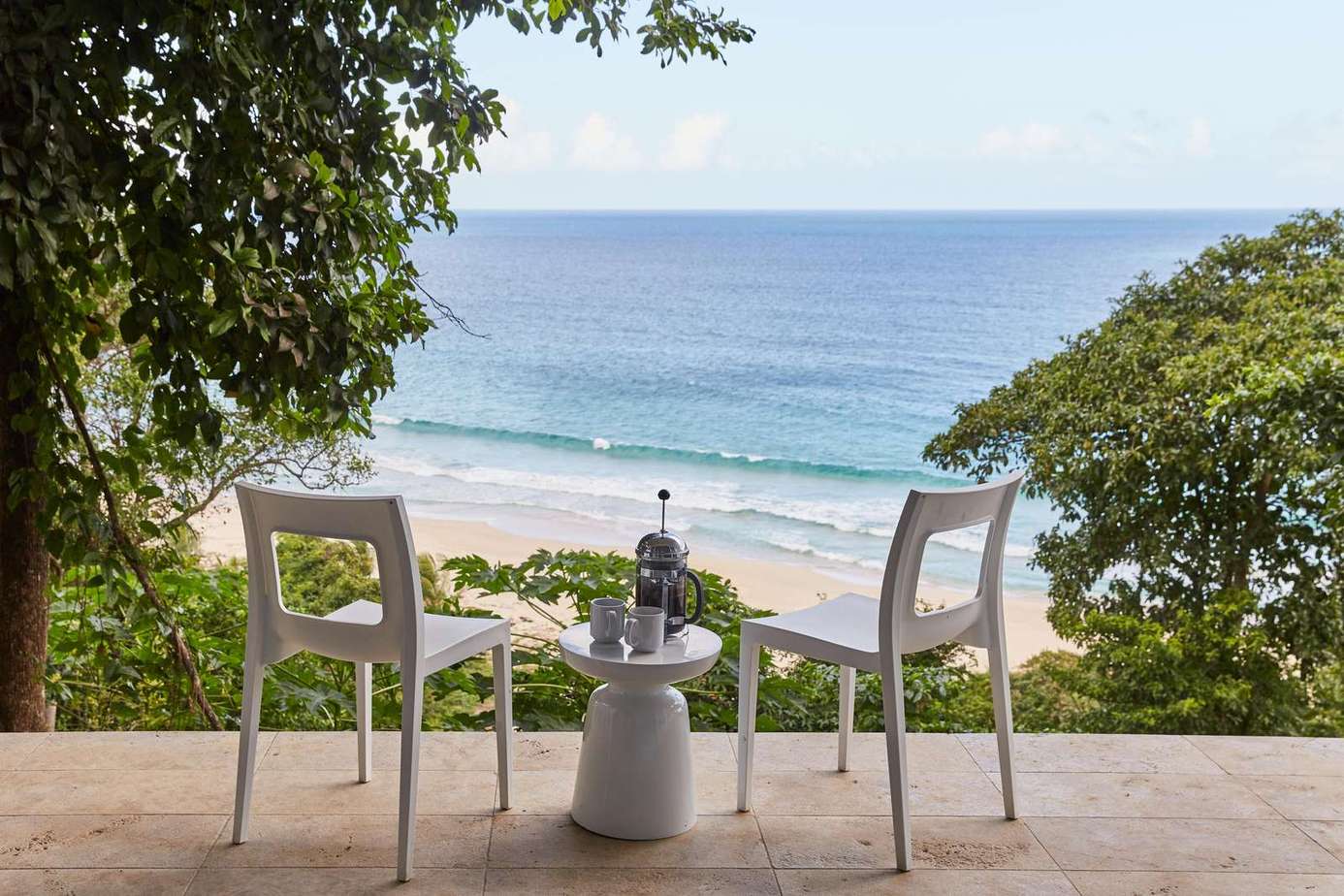 Oceanfront patio with stunning beach and sunset views