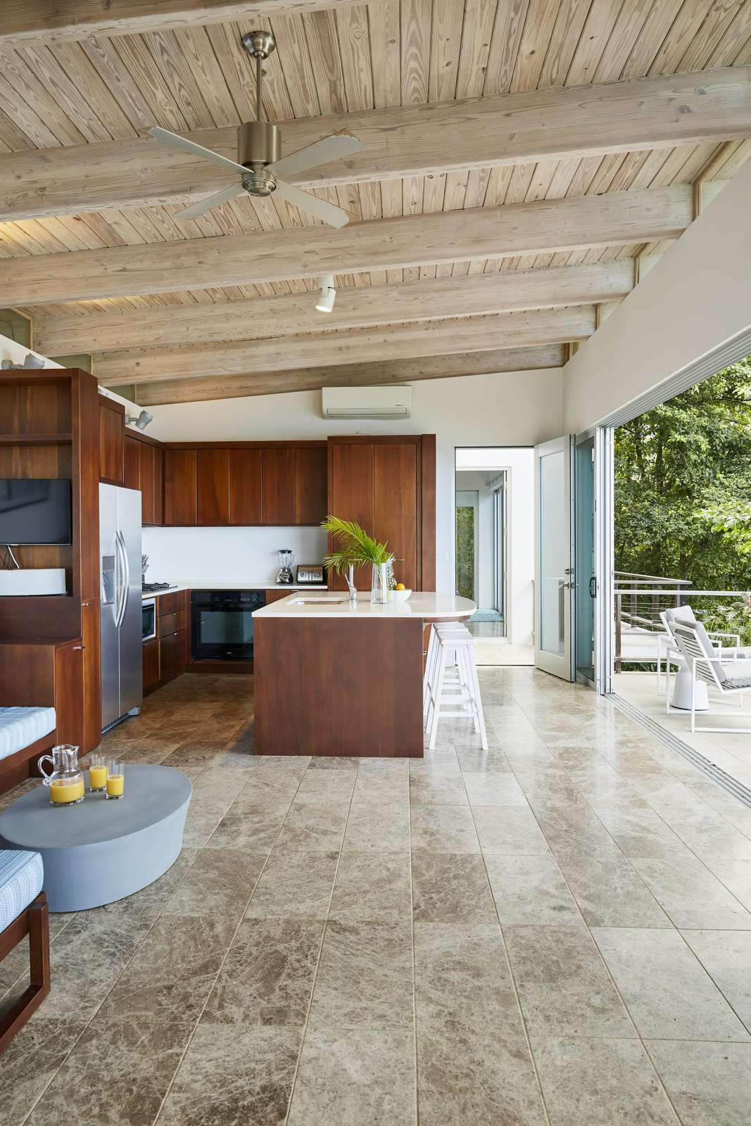 Sunlit kitchen with sleek wood accents and open flow