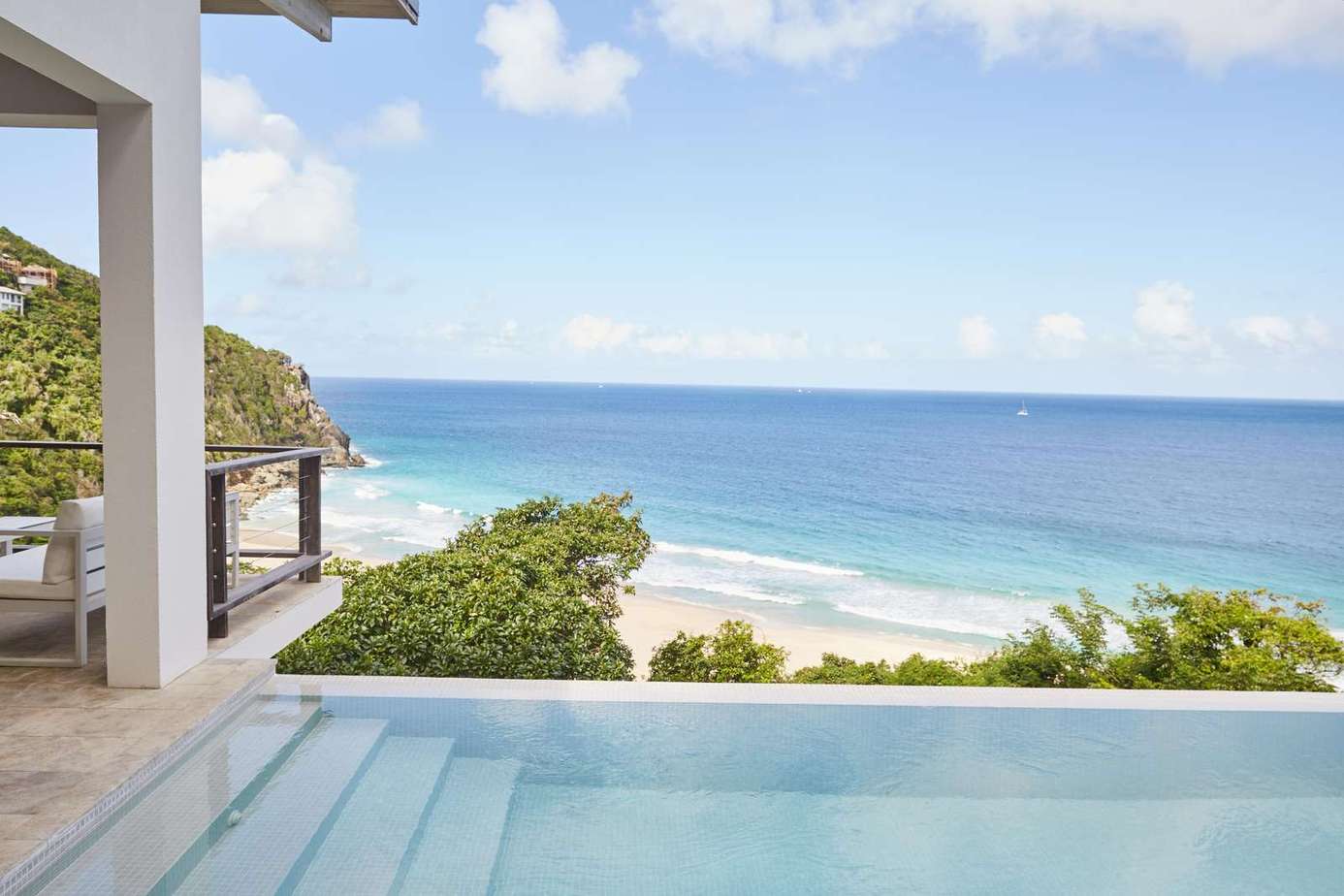 Oceanfront patio with infinity pool and stunning beach views