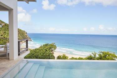 Oceanfront patio with infinity pool and stunning beach views
