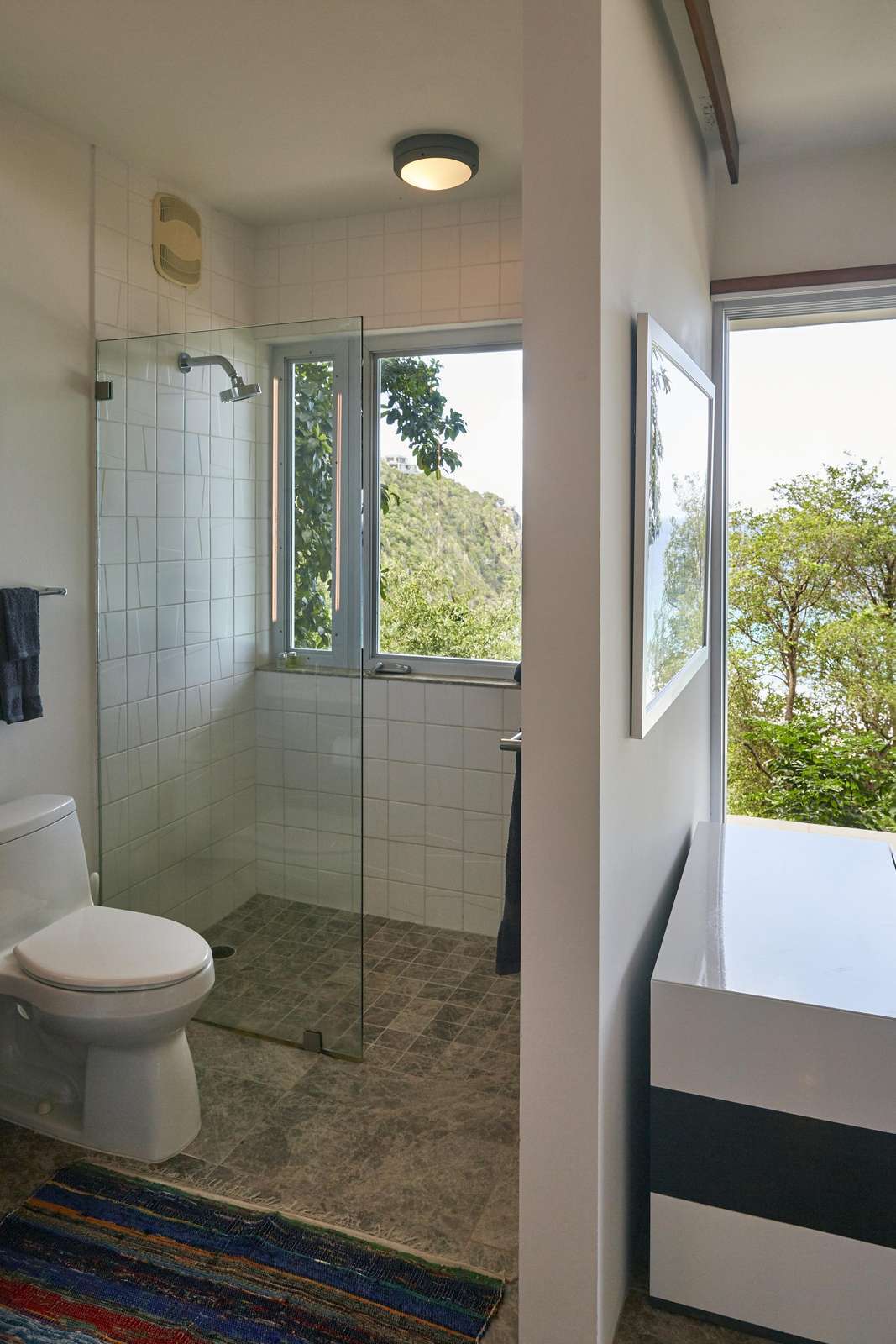 Bright bathroom with scenic window views and modern fixtures