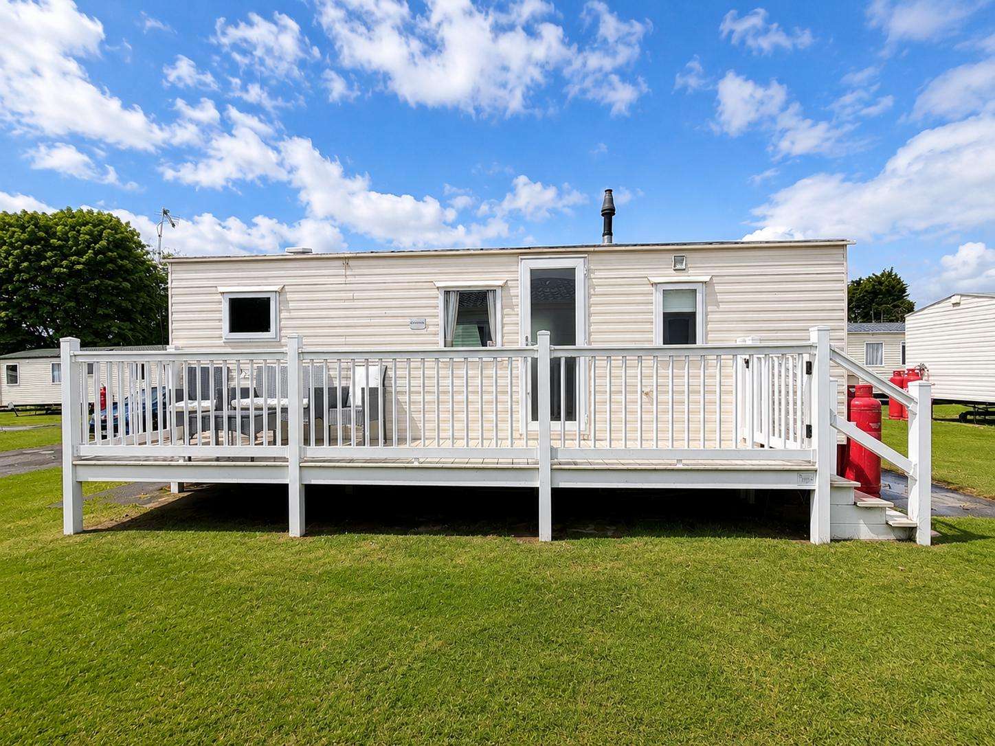 Enjoy your morning coffee or evening drink on the side decking. - property
