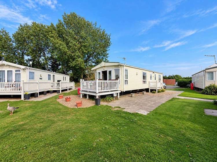 33043CL⭐ – Cedar Lake area, 3 bed, 6 berth caravan with lake view and decking. Opal rated. Preview 1