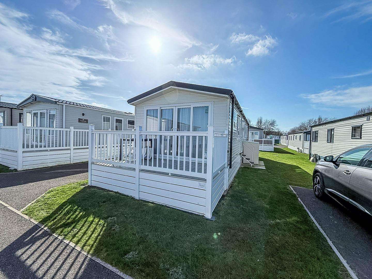 Planning a romantic getaway UK? Look no further than a cosy UK staycation at Broadlands Sands Holiday Park, where you can unwind outside a caravan with decking and discover the charm of Great Yarmouth. - property