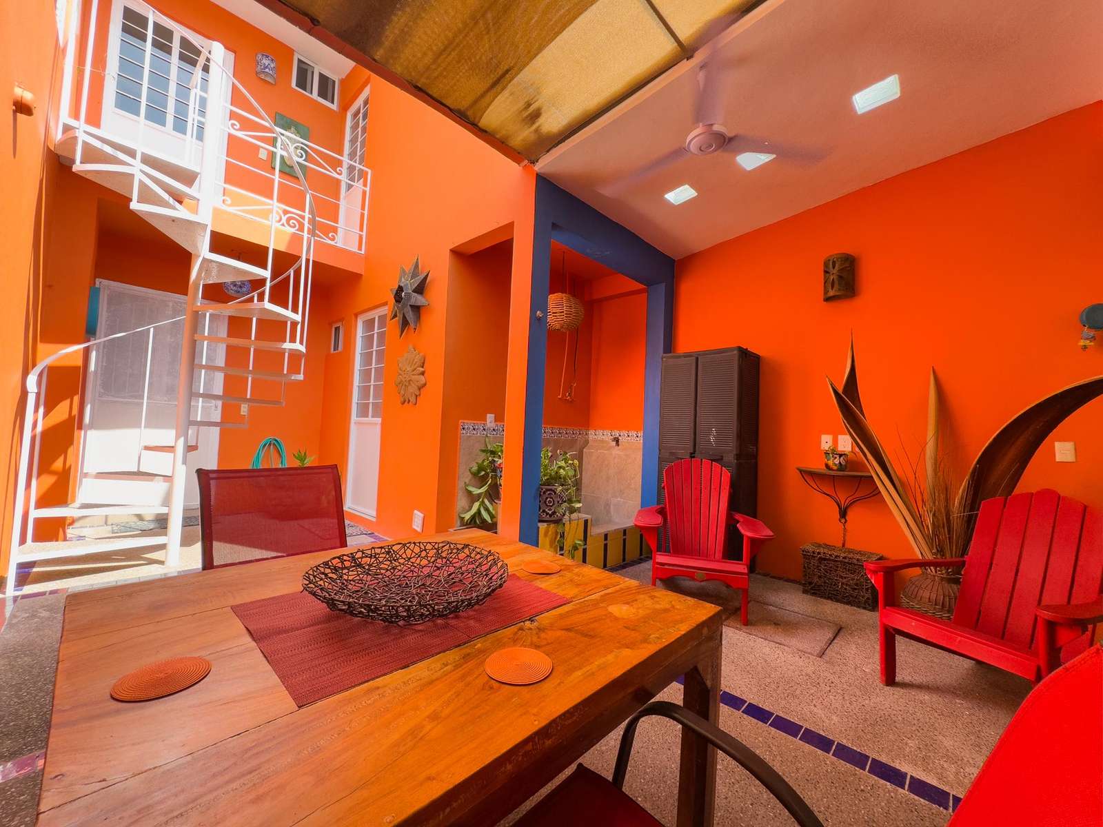 Vibrant courtyard with cozy seating and natural light - property