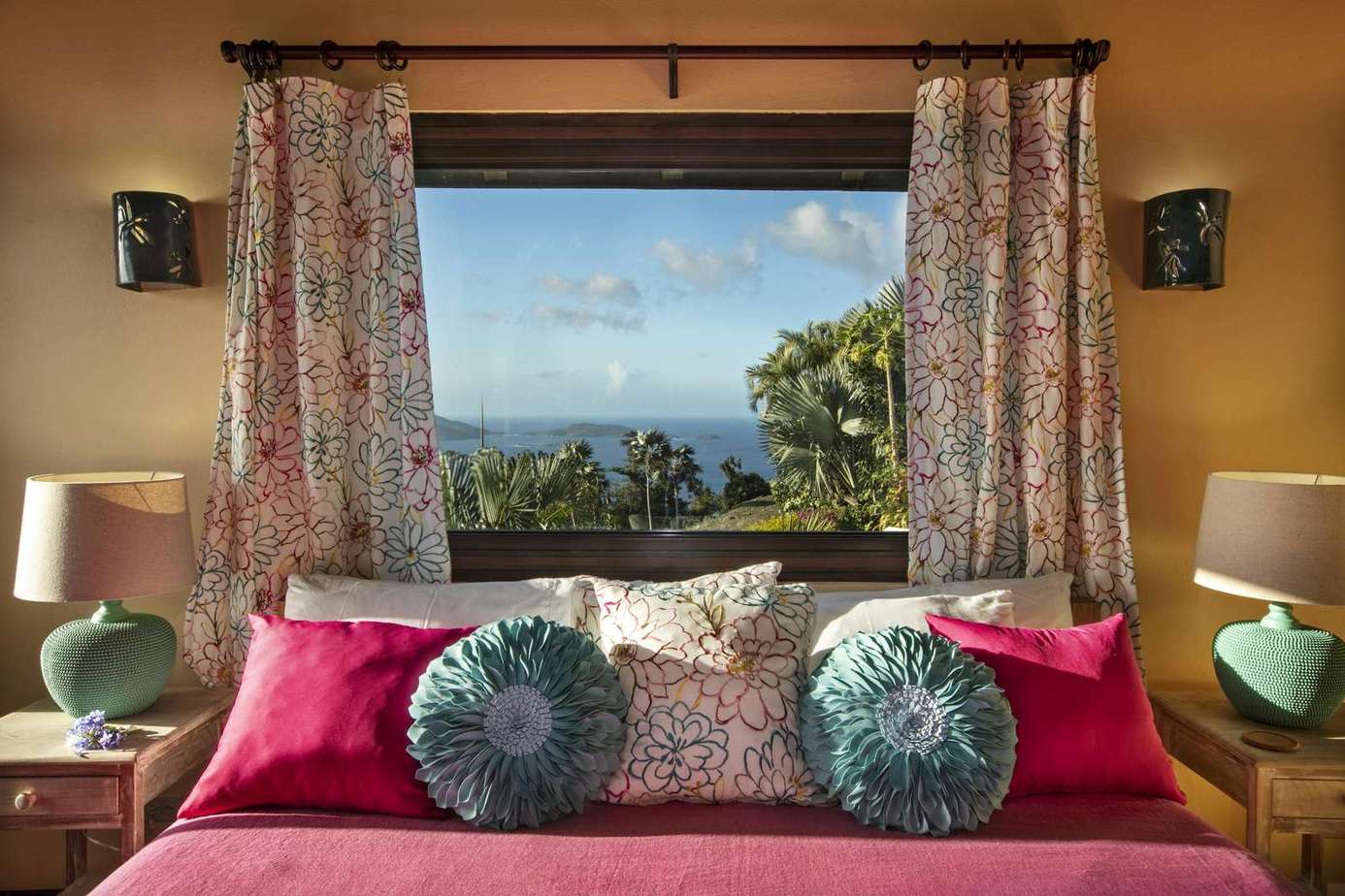 Cozy bedroom with vibrant accents and scenic window views
