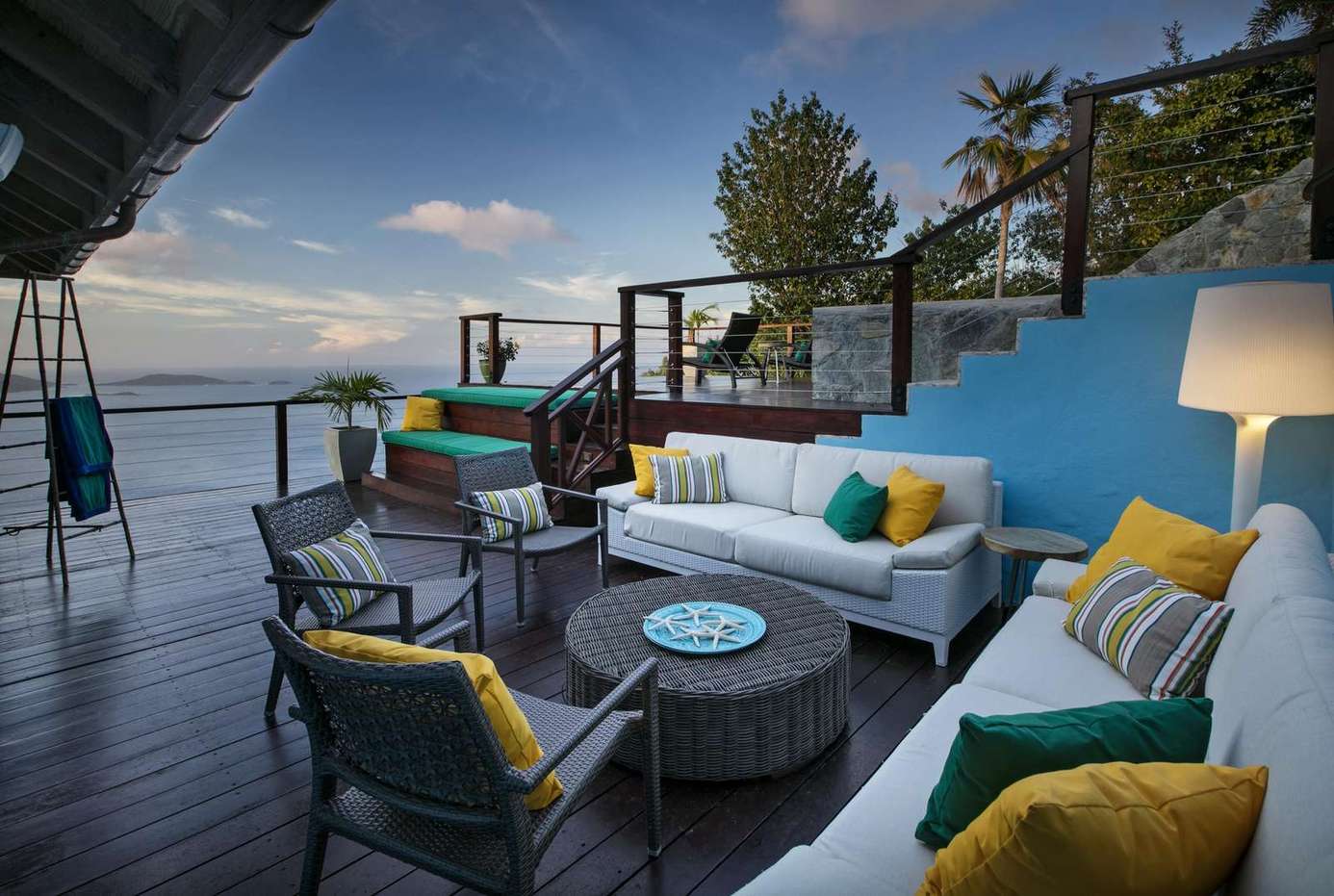 Spacious lakeside deck with cozy seating and stunning views