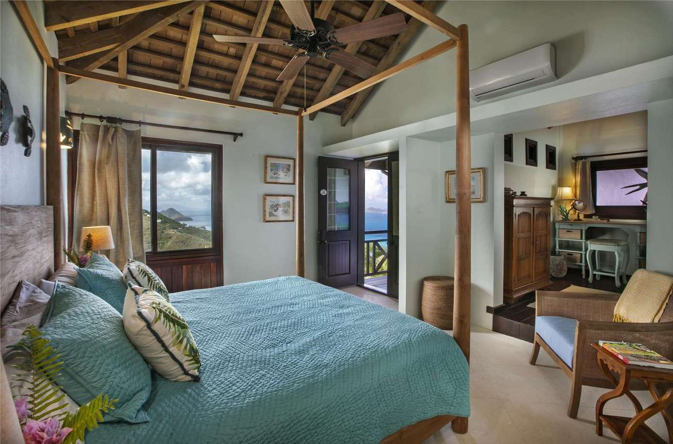 Cozy bedroom retreat with vaulted ceilings and natural light