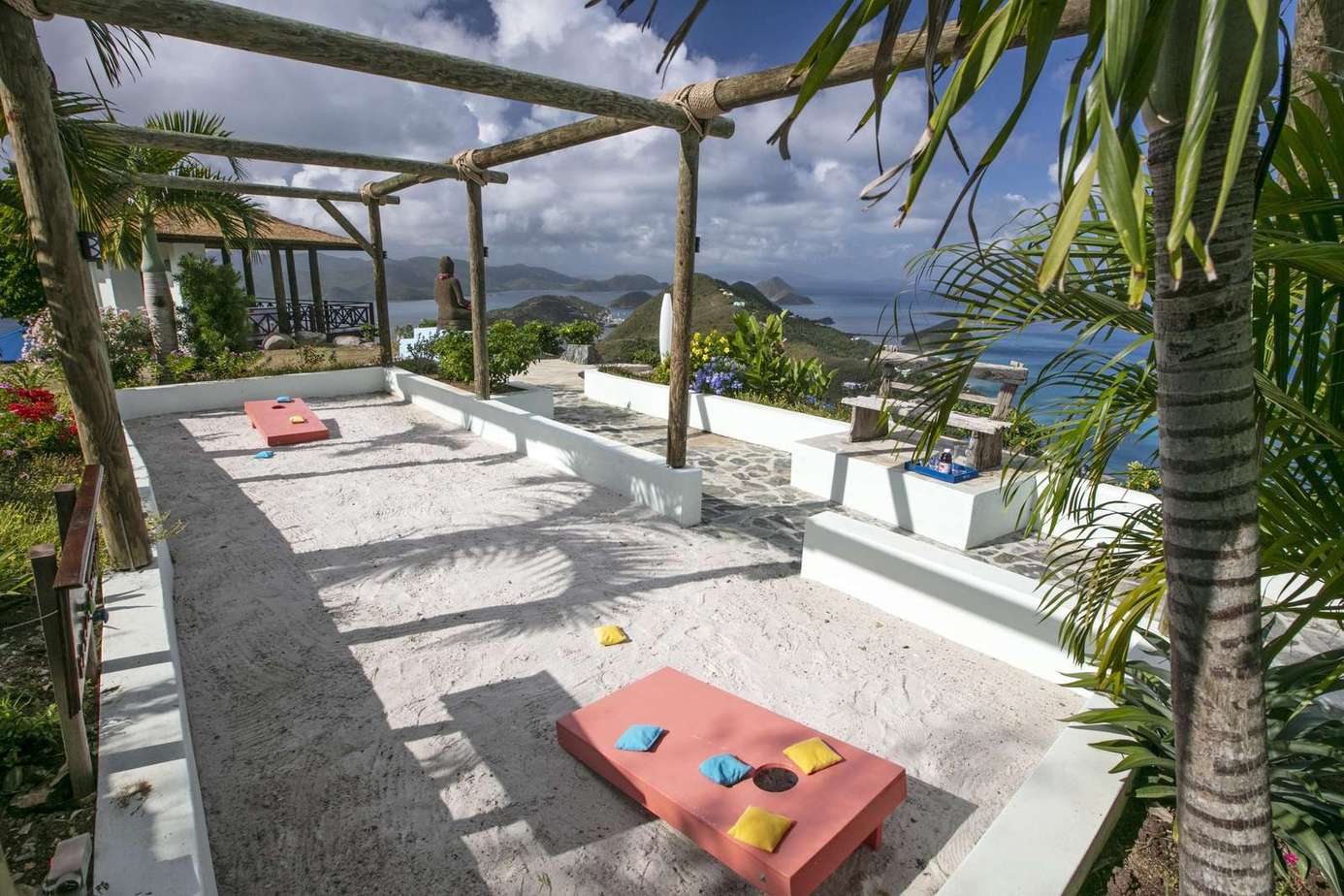 Sun-drenched rooftop terrace with ocean views and lounge beds
