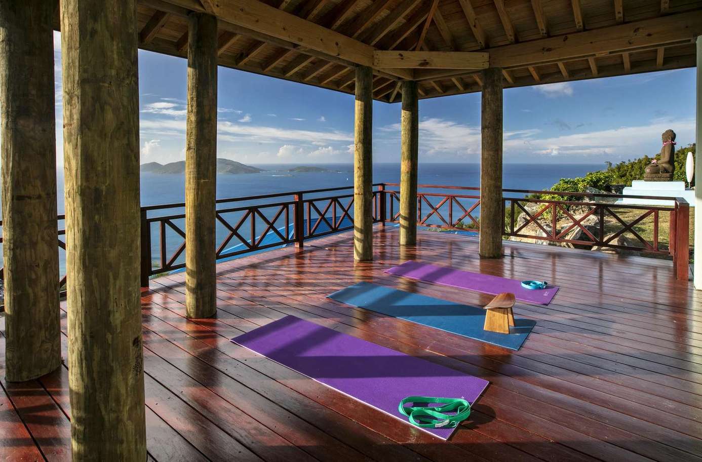 Spacious covered deck with panoramic ocean views and cozy seating