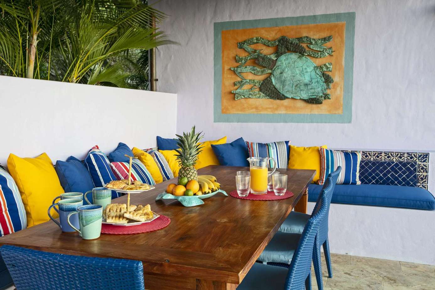 Vibrant outdoor dining nook with cozy cushioned seating