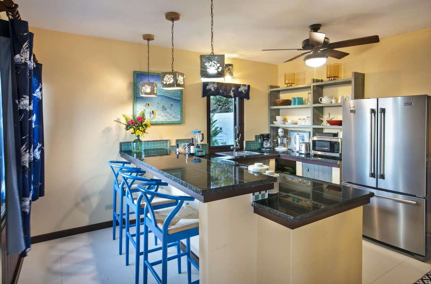 Bright, modern kitchen with breakfast bar and vibrant seating