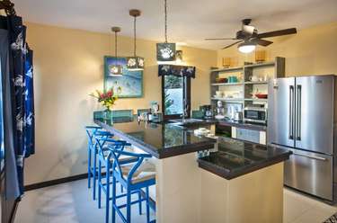 Bright, modern kitchen with breakfast bar and vibrant seating