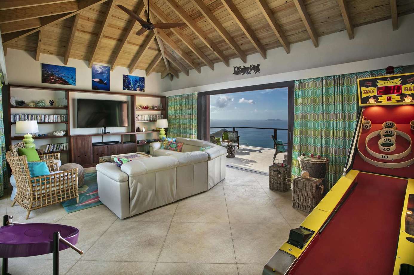 Spacious living room with ocean views and game fun
