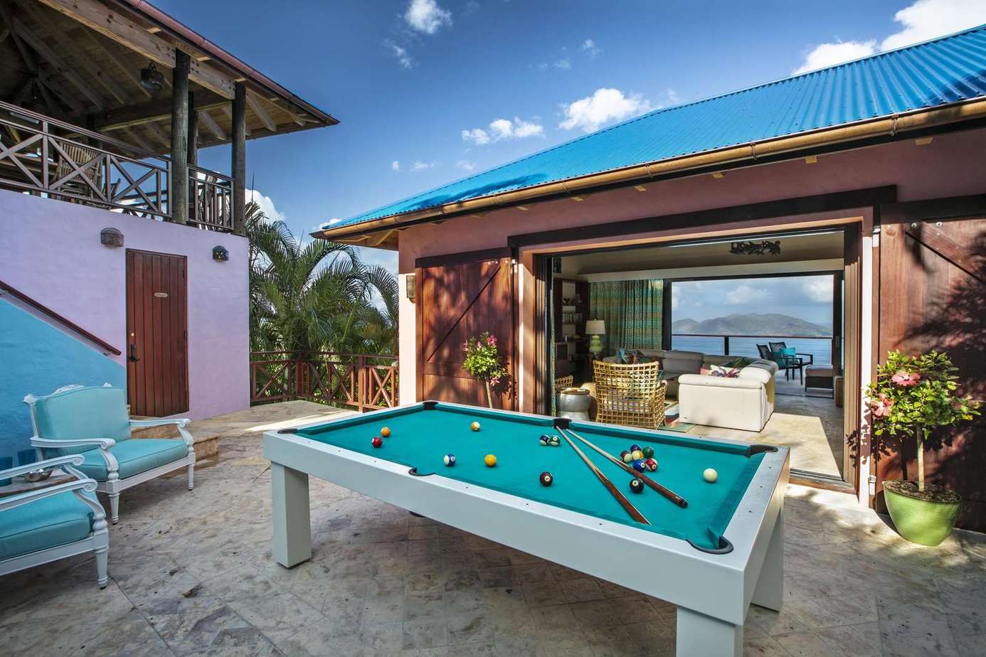 Outdoor patio with pool table and ocean views for fun gatherings