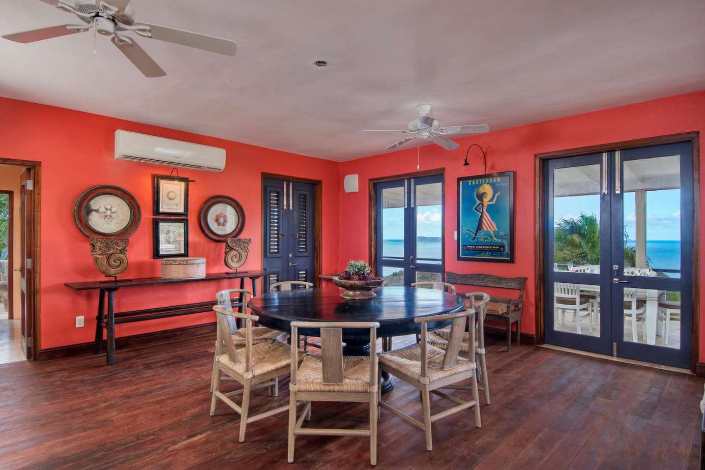 Spacious dining room with vibrant walls and scenic views