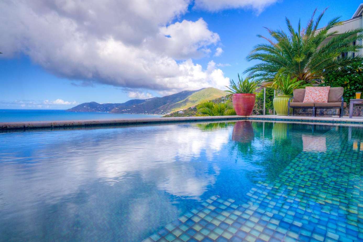 Infinity pool with stunning mountain and ocean views