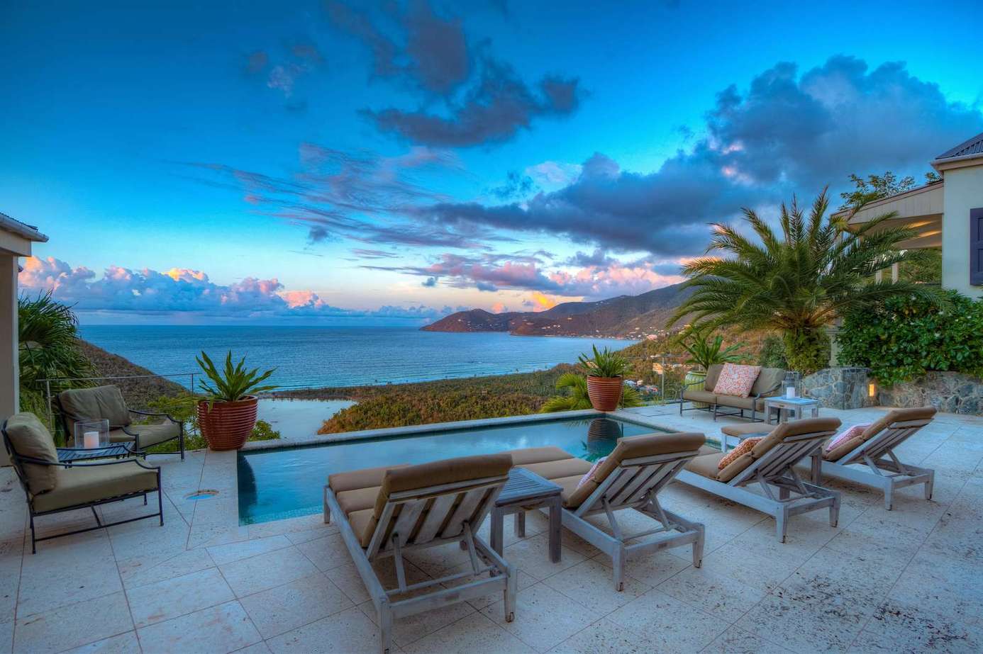 Sunset views from the spacious oceanfront patio with loungers