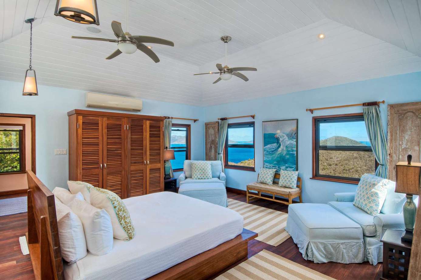 Spacious bedroom retreat with ocean views and cozy seating