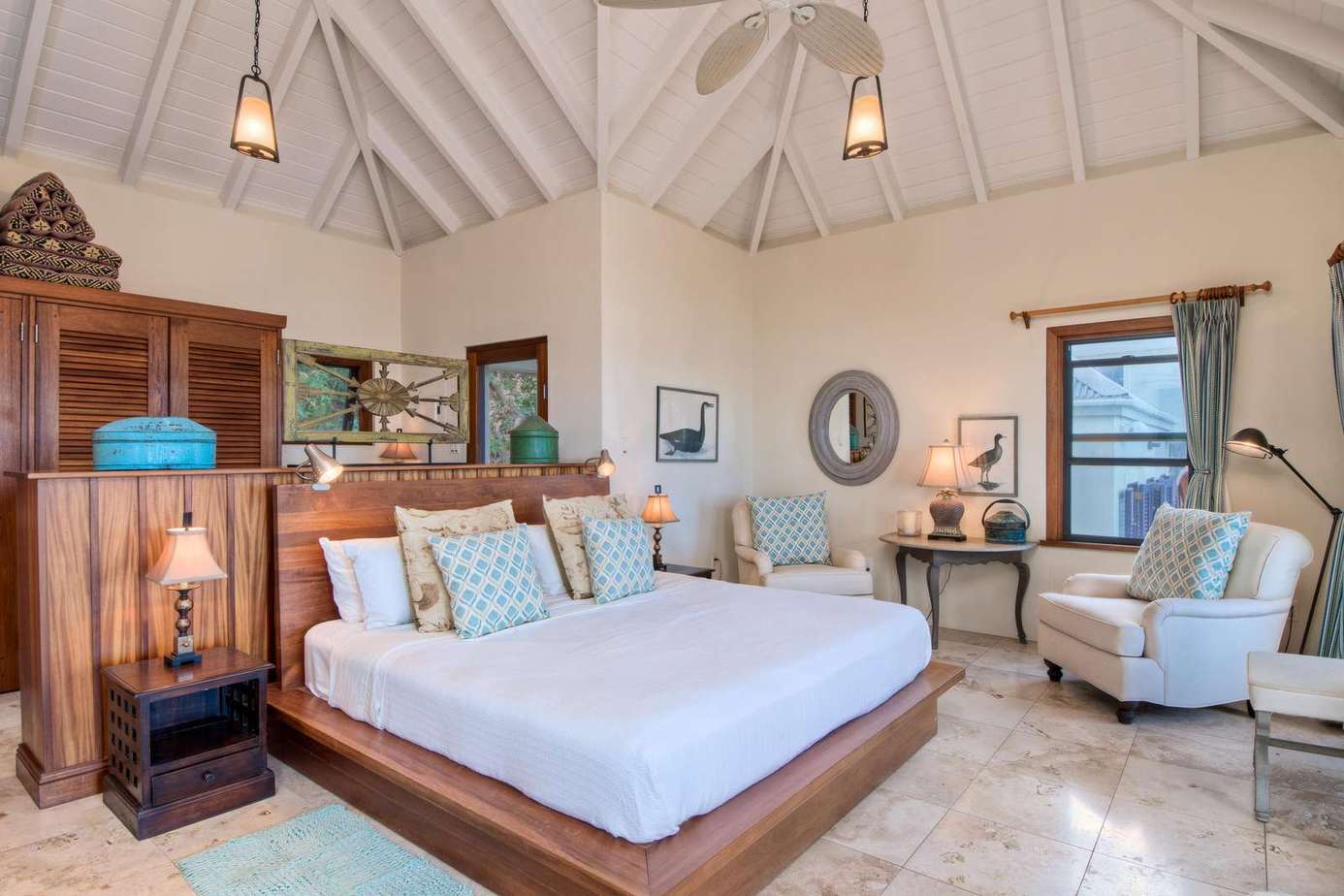 Spacious bedroom retreat with vaulted ceilings and cozy seating