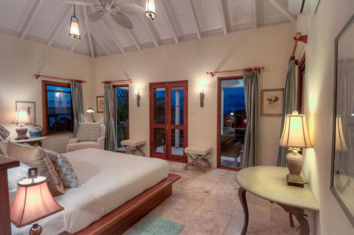 Spacious bedroom with vaulted ceilings and cozy ambiance
