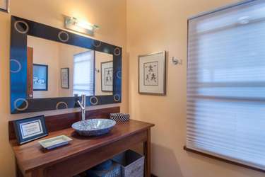 Chic bathroom with modern vessel sink and ambient lighting