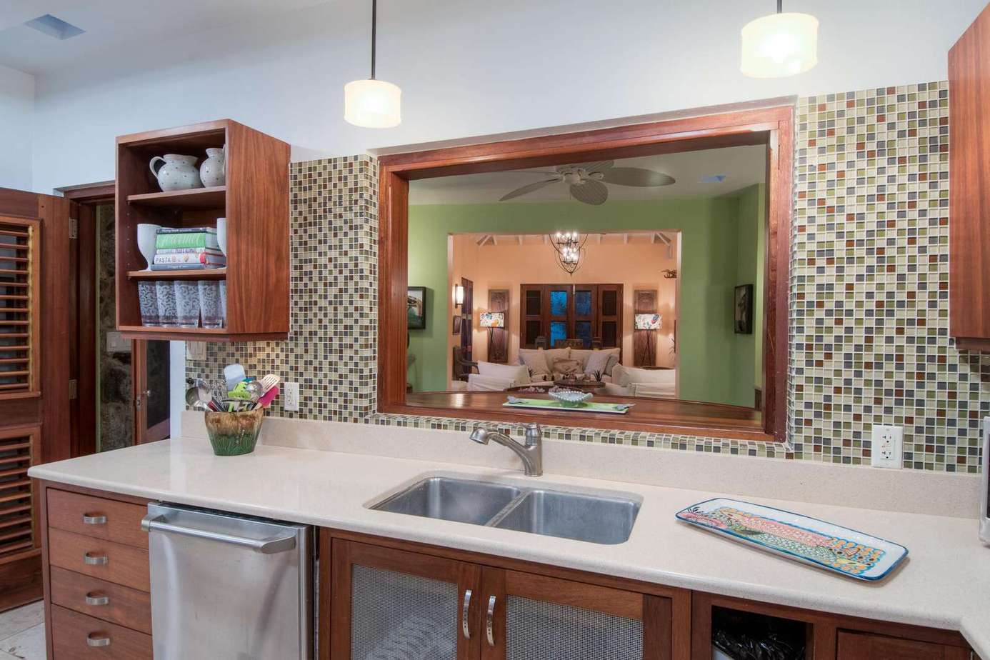 Modern kitchen with sleek countertops and vibrant backsplash