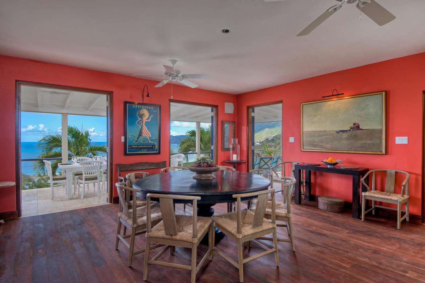 Bright dining room with ocean views and cozy fireplace