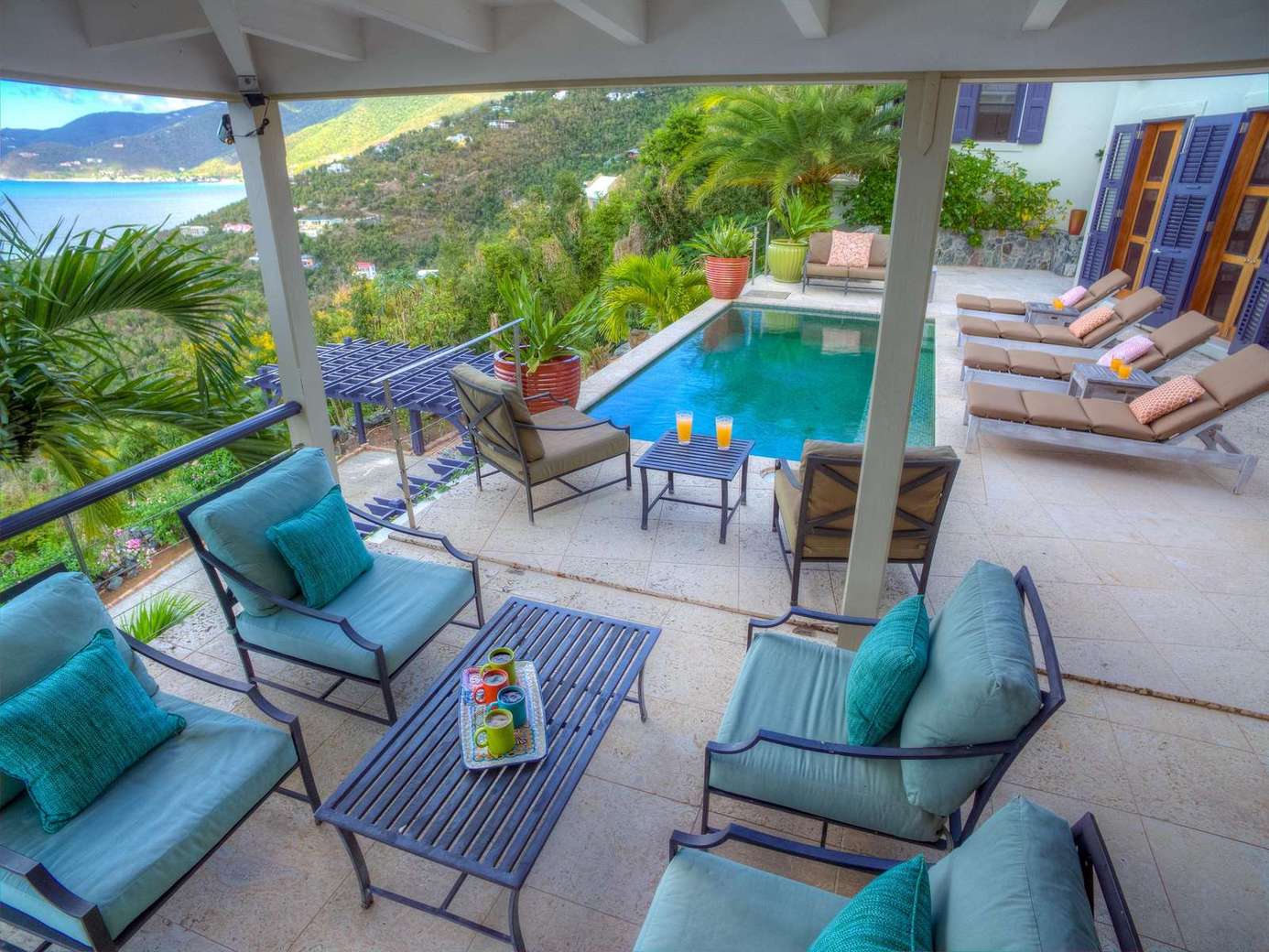 Spacious covered patio with pool and stunning hillside views