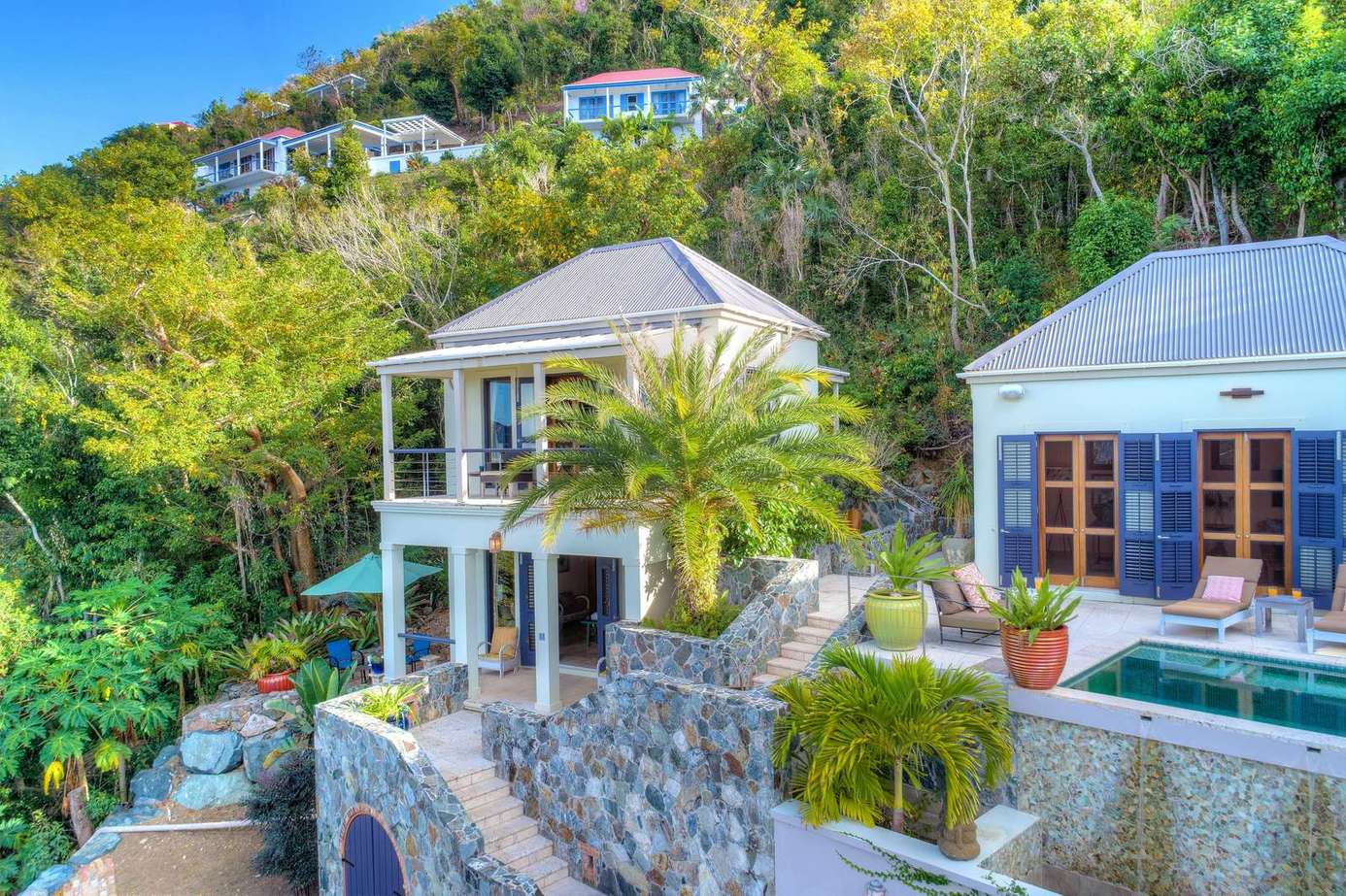 Secluded hillside retreat with spacious balconies and lush views