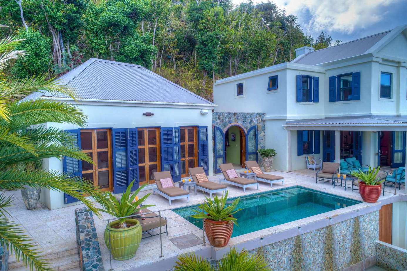 Secluded poolside retreat with lush tropical surroundings