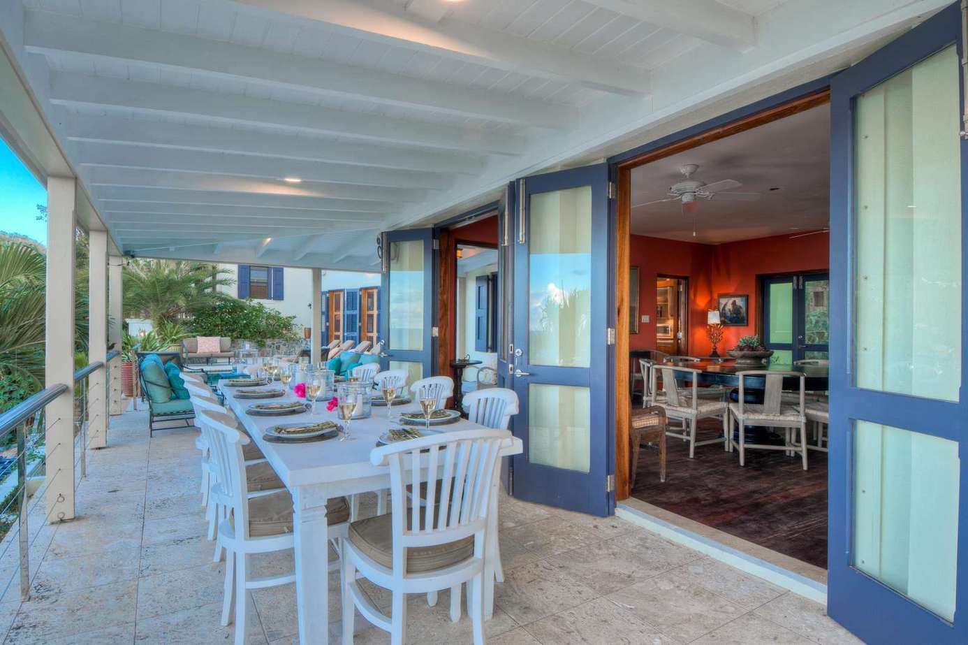 Spacious covered patio with ocean views and dining area