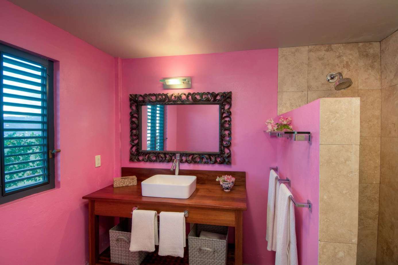 Vibrant bathroom with modern sink and spacious shower