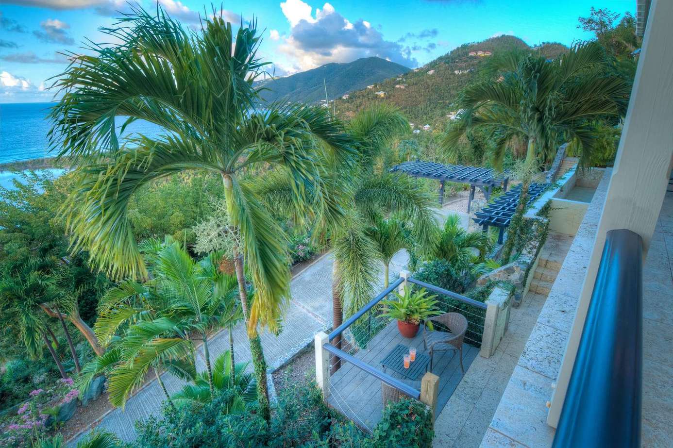 Balcony retreat with lush palm views and ocean breeze