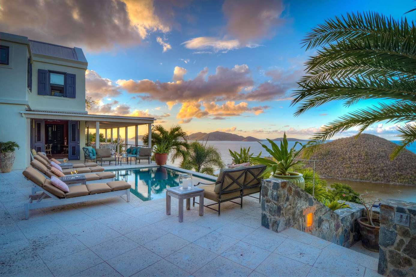 Sunset poolside retreat with ocean views and tropical vibes