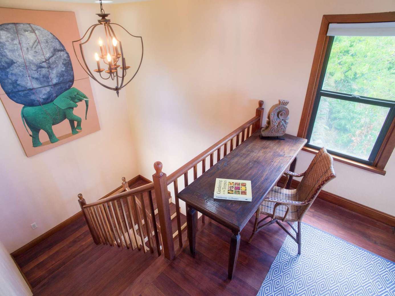Cozy upstairs nook with natural light and workspace