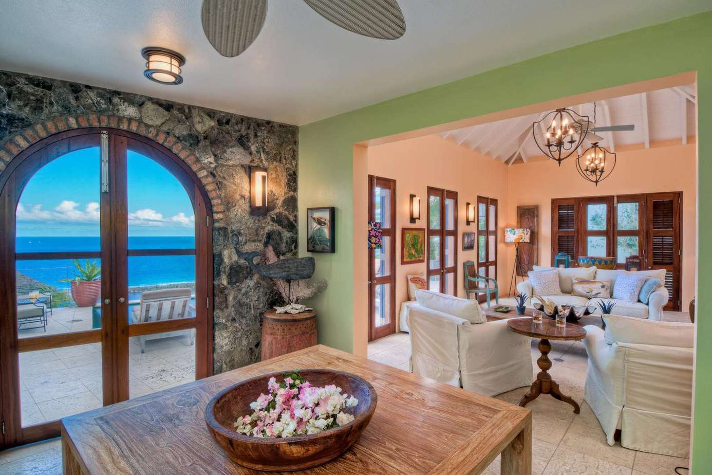 Sunlit living room with stunning ocean views and cozy charm
