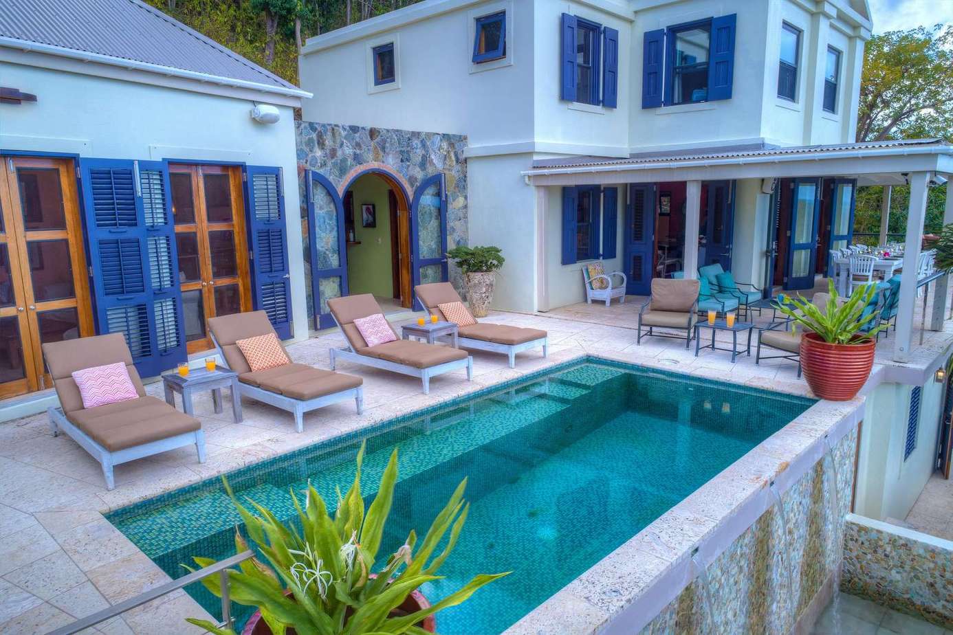 Sun-soaked patio with poolside loungers for ultimate relaxation
